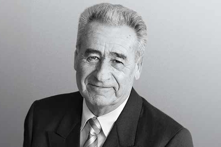 Siegfried Meister, founder of RATIONAL, shown in a traditional black-and-white portrait.