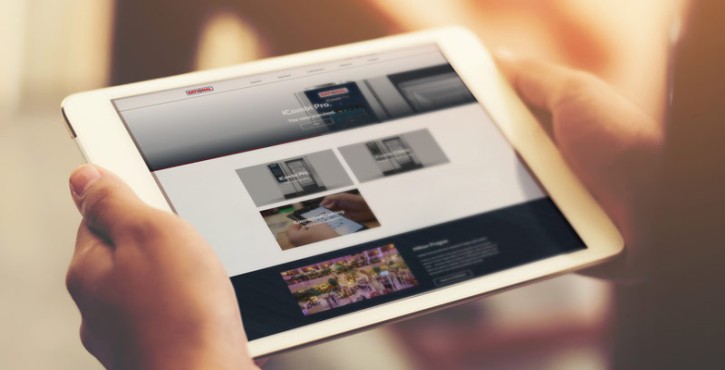 User viewing RATIONAL iCombi Pro combi oven website on tablet.