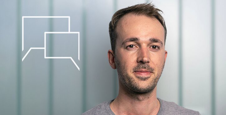 Portrait of Robin Rehfeldt from Statista in front of modern office background.